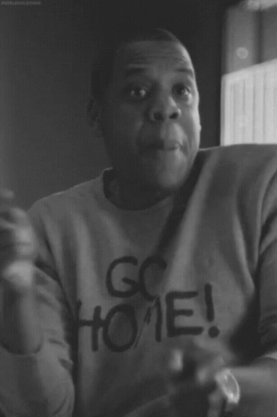 A Black And White Photo Of A Man Wearing A Go Home Sweatshirt GIF