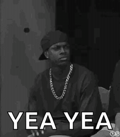 A Black And White Photo Of A Man Wearing A Hat And A Necklace With The Words Yea Yea Written On It . GIF