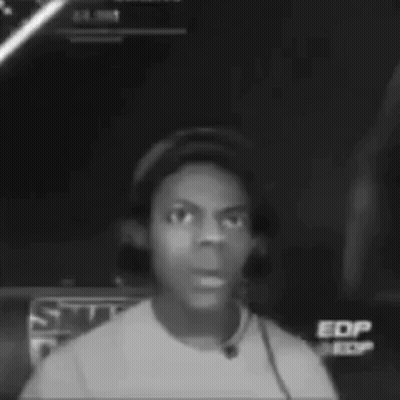 A Black And White Photo Of A Man Wearing A Hat And Headphones . GIF
