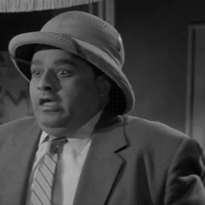 A Black And White Photo Of A Man Wearing A Hat GIF