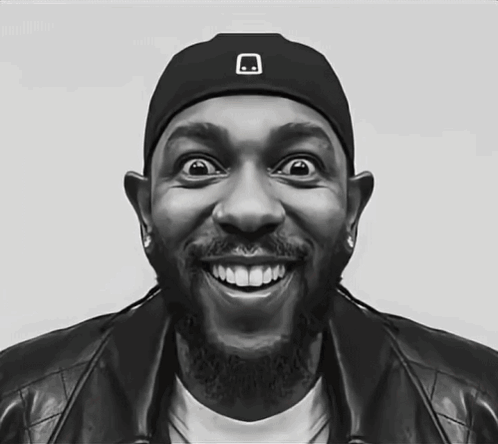 a black and white photo of a man wearing a hat with a skull on it