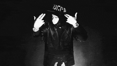 A Black And White Photo Of A Man Wearing A Hat With The Letters Bgfd On It GIF