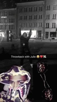 A Black And White Photo Of A Man Wearing A Hoodie That Says Throwback With Julie .. GIF