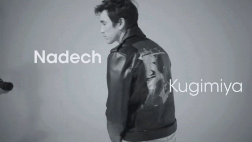 A Black And White Photo Of A Man Wearing A Leather Jacket With The Name Nadech And Kugimiya GIF