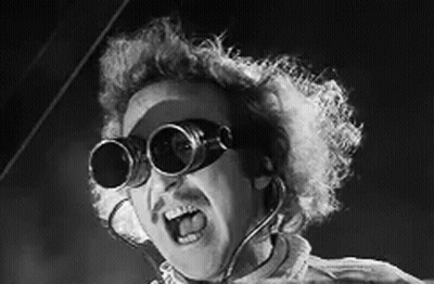 A Black And White Photo Of A Man Wearing A Pair Of Goggles . GIF