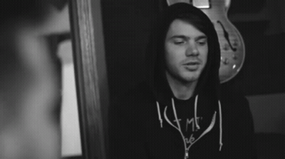 A Black And White Photo Of A Man Wearing A Shirt That Says ' I Am ' GIF