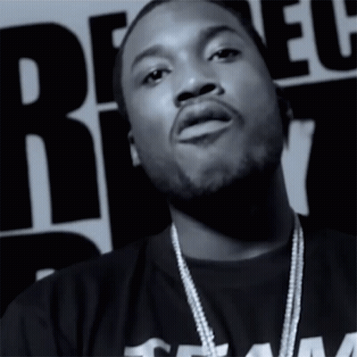 A Black And White Photo Of A Man Wearing A Shirt With The Word Team On It GIF