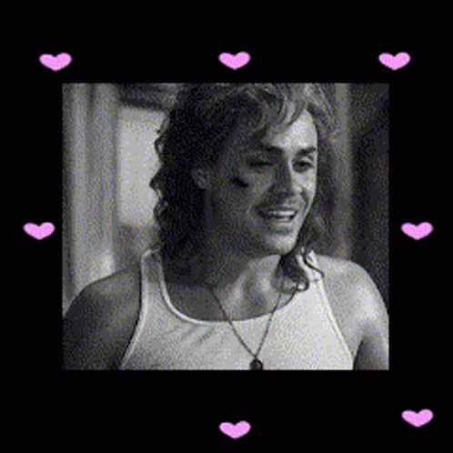 A Black And White Photo Of A Man Wearing A Tank Top With Pink Hearts Around Him GIF