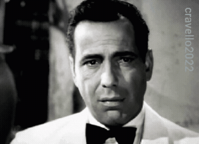 A Black And White Photo Of A Man Wearing A Tuxedo And Bow Tie With The Year 2022 On The Bottom GIF