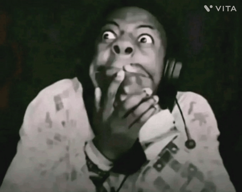 A Black And White Photo Of A Man Wearing Headphones With Vita Written In The Corner GIF