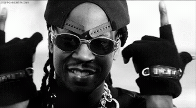 A Black And White Photo Of A Man Wearing Sunglasses And A Hat Giving The Middle Finger GIF