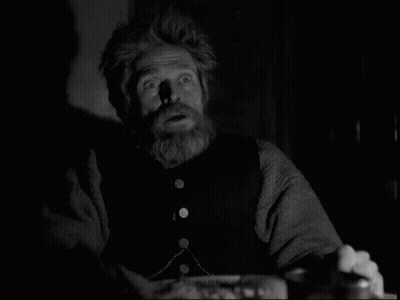 A Black And White Photo Of A Man With A Beard And A Surprised Look On His Face GIF
