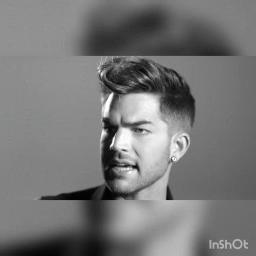 A Black And White Photo Of A Man With A Beard And Earring Says Inshot GIF