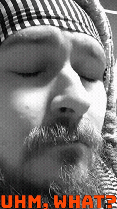 A Black And White Photo Of A Man With A Beard And The Words Uhm What On The Bottom GIF