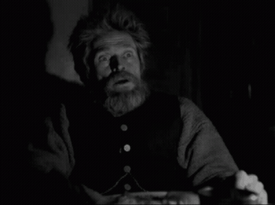 A Black And White Photo Of A Man With A Beard Making A Surprised Face GIF