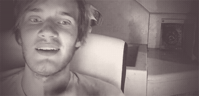 A Black And White Photo Of A Man With A Beard GIF