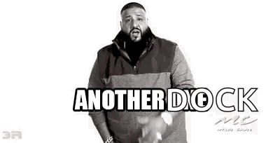 A Black And White Photo Of A Man With A Beard Wearing A Dock Mc Sweater . GIF