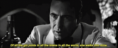 A Black And White Photo Of A Man With A Bottle Of Alcohol And The Words Of All The Gin Joints In All The Towns GIF