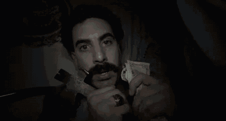 A Black And White Photo Of A Man With A Mustache Holding A Gun And Money With The Words You Can Barely See GIF