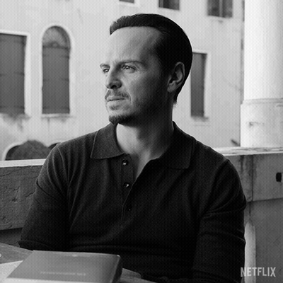 A Black And White Photo Of A Man With A Netflix Logo GIF
