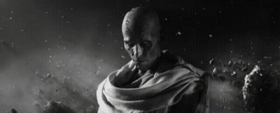 A Black And White Photo Of A Man With A Scarf Around His Waist GIF