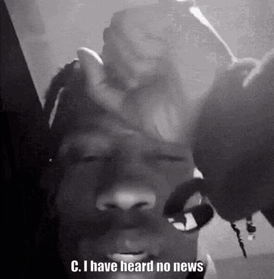 A Black And White Photo Of A Man With Dreadlocks Holding His Hand To His Forehead . GIF