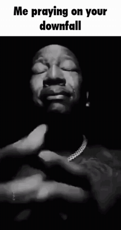 A Black And White Photo Of A Man With His Eyes Closed And The Caption " Me Praying On Your Downfall " GIF