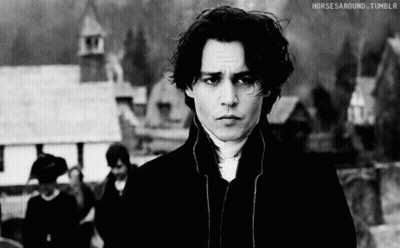 A Black And White Photo Of A Man With Horses Around Tumblr Written Below Him GIF