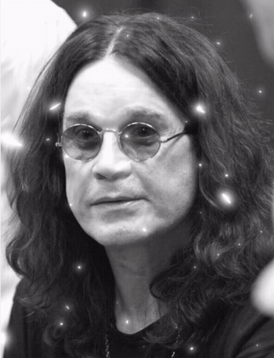 A Black And White Photo Of A Man With Long Hair And Sunglasses GIF