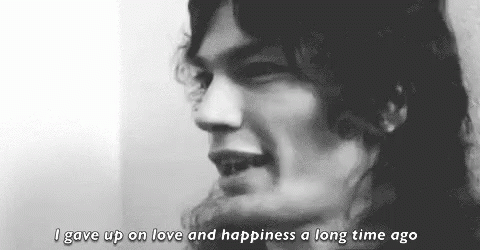 A Black And White Photo Of A Man With Long Hair And The Words `` I Gave Up On Love And Happiness A Long Time Ago '' GIF