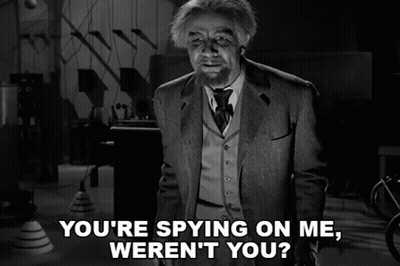 A Black And White Photo Of A Man With The Caption " You 'Re Spying On Me Weren 'T You " GIF