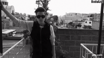 A Black And White Photo Of A Man With The Word Budaazul On The Bottom Right GIF