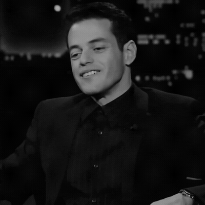 A Black And White Photo Of A Man With The Word Et On The Bottom Left GIF