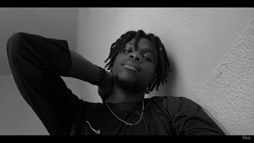A Black And White Photo Of A Man With The Word Veo On The Bottom GIF
