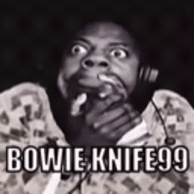 A Black And White Photo Of A Man With The Words Bowie Knife99 GIF