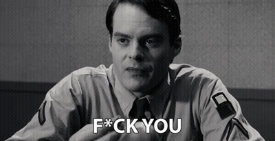 A Black And White Photo Of A Man With The Words F * Ck You On His Chest GIF