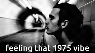 A Black And White Photo Of A Man With The Words Feeling That 1975 Vibe Above Him GIF