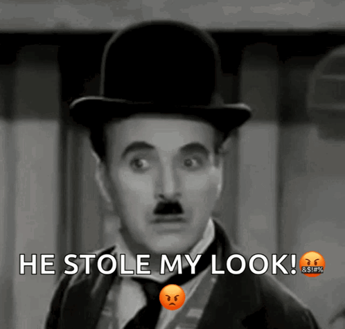 A Black And White Photo Of A Man With The Words He Stole My Look Above Him GIF