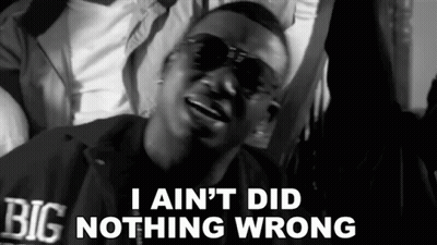 A Black And White Photo Of A Man With The Words I Ain 'T Did Nothing Wrong GIF