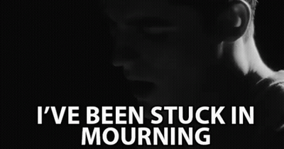 A Black And White Photo Of A Man With The Words " I 'Ve Been Stuck In Mourning " Above Him GIF