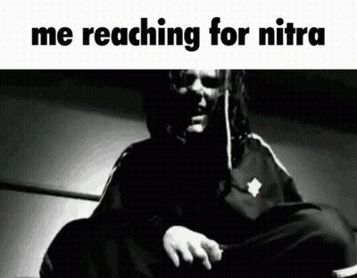 A Black And White Photo Of A Man With The Words " Me Reaching For Nitra " On The Bottom GIF