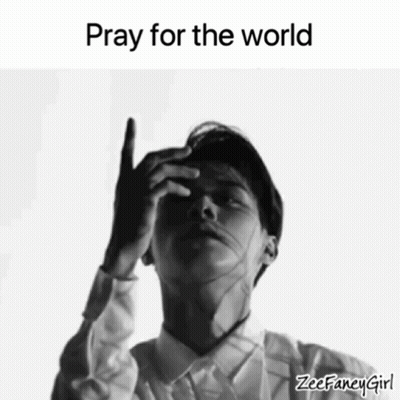 a black and white photo of a man with the words pray for the world