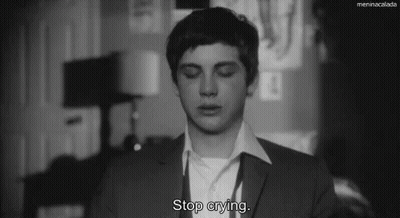 A Black And White Photo Of A Man With The Words Stop Crying GIF