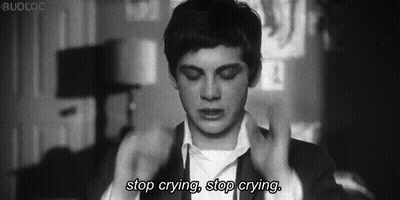 A Black And White Photo Of A Man With The Words Stop Crying Stop Crying Below Him GIF