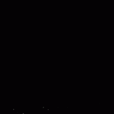 A Black And White Photo Of A Monster Flying Through The Air . GIF
