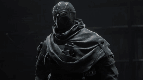 A Black And White Photo Of A Person In A Mask GIF