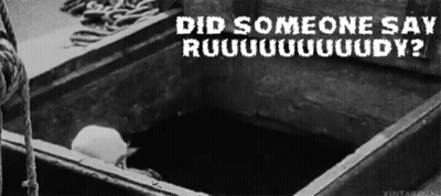 A Black And White Photo Of A Person Laying In A Box With The Words `` Did Someone Say Ruuuuuuudy '' . GIF