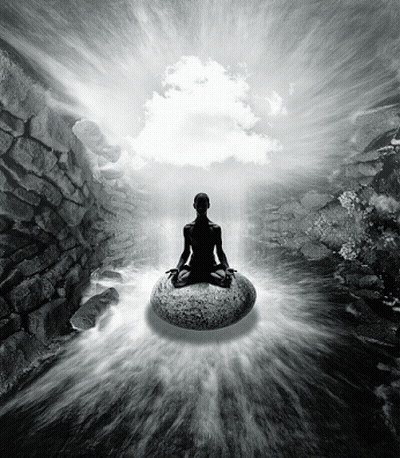 A Black And White Photo Of A Person Meditating On A Large Rock GIF