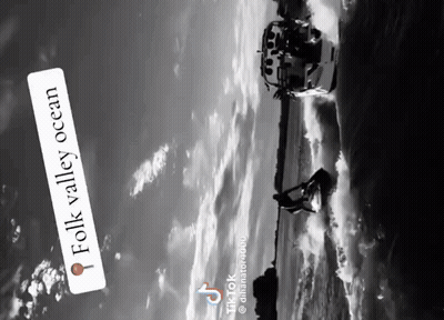 A Black And White Photo Of A Person On A Jet Ski With A Caption That Says Folk Valley Ocean GIF