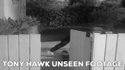 A Black And White Photo Of A Person Opening A Gate With The Words Tony Hawk Unseen Footage Below It GIF